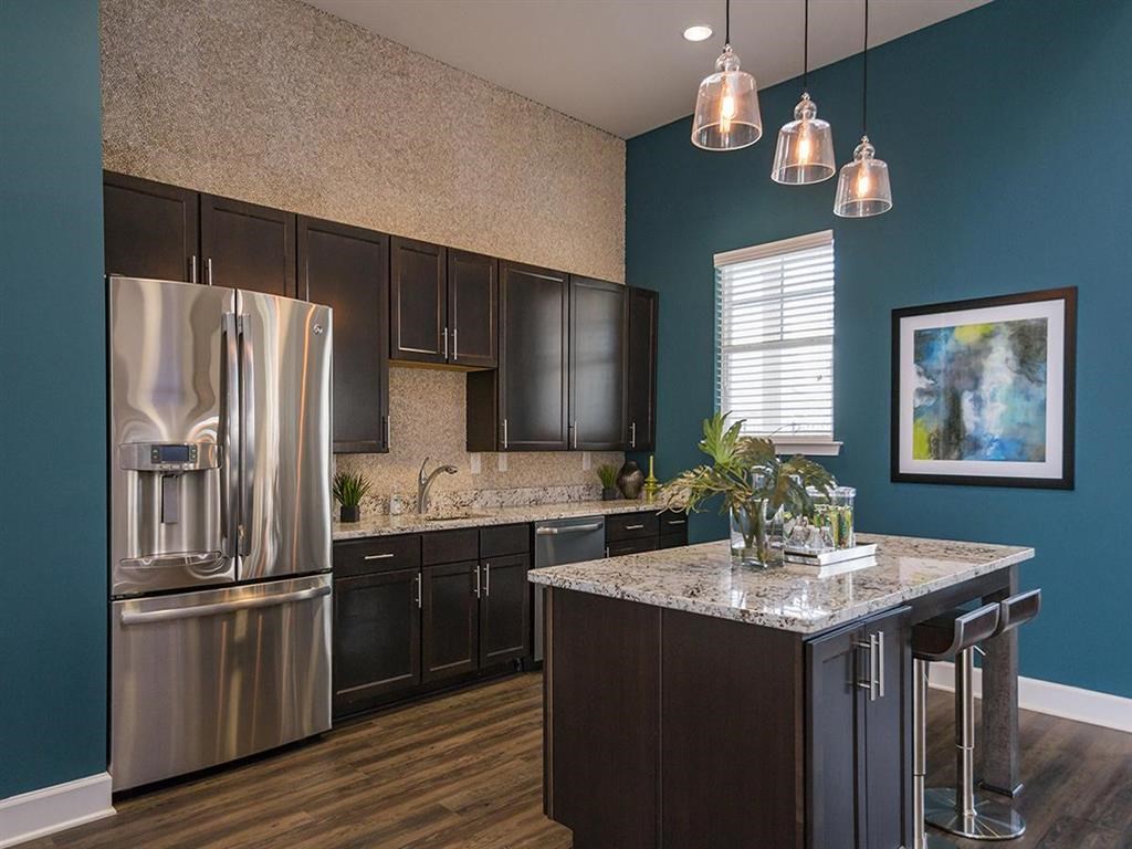 a kitchen with stainless steel appliances and a counter top