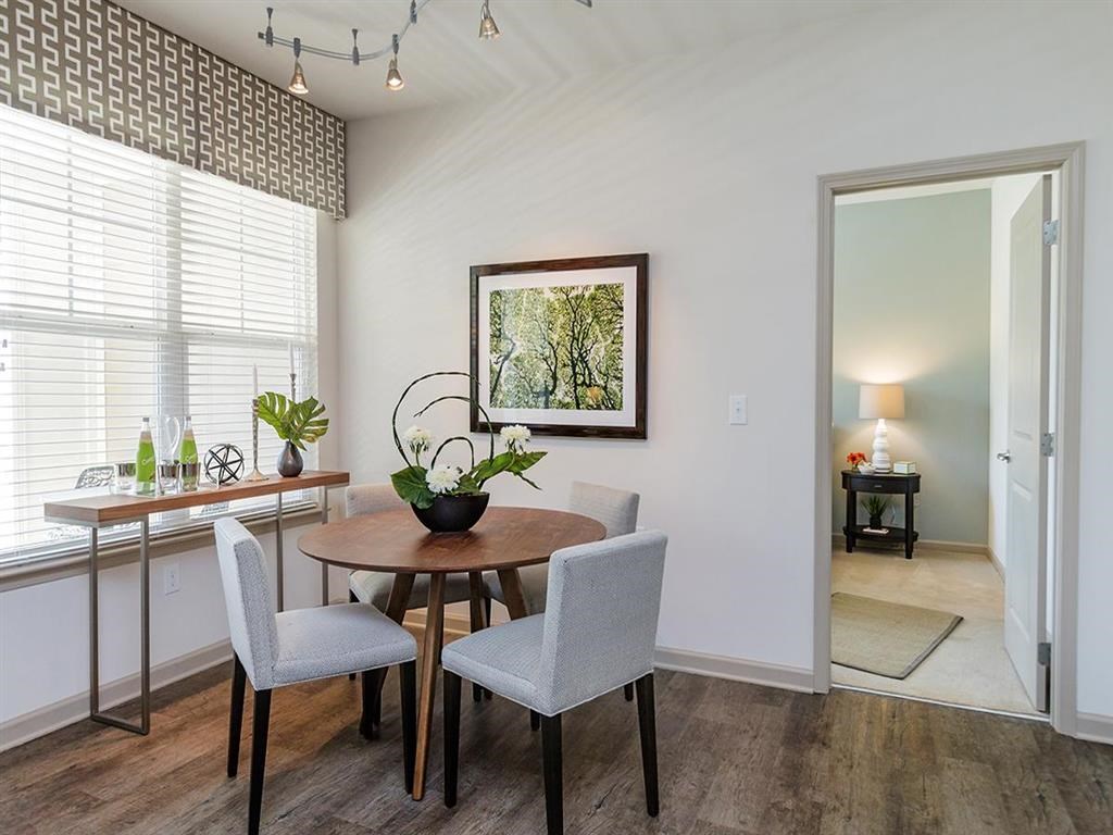 a dining room with a table and chairs