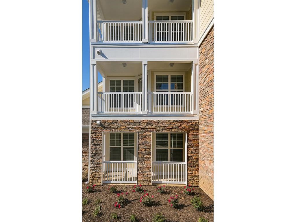 a view of the balcony of an apartment building