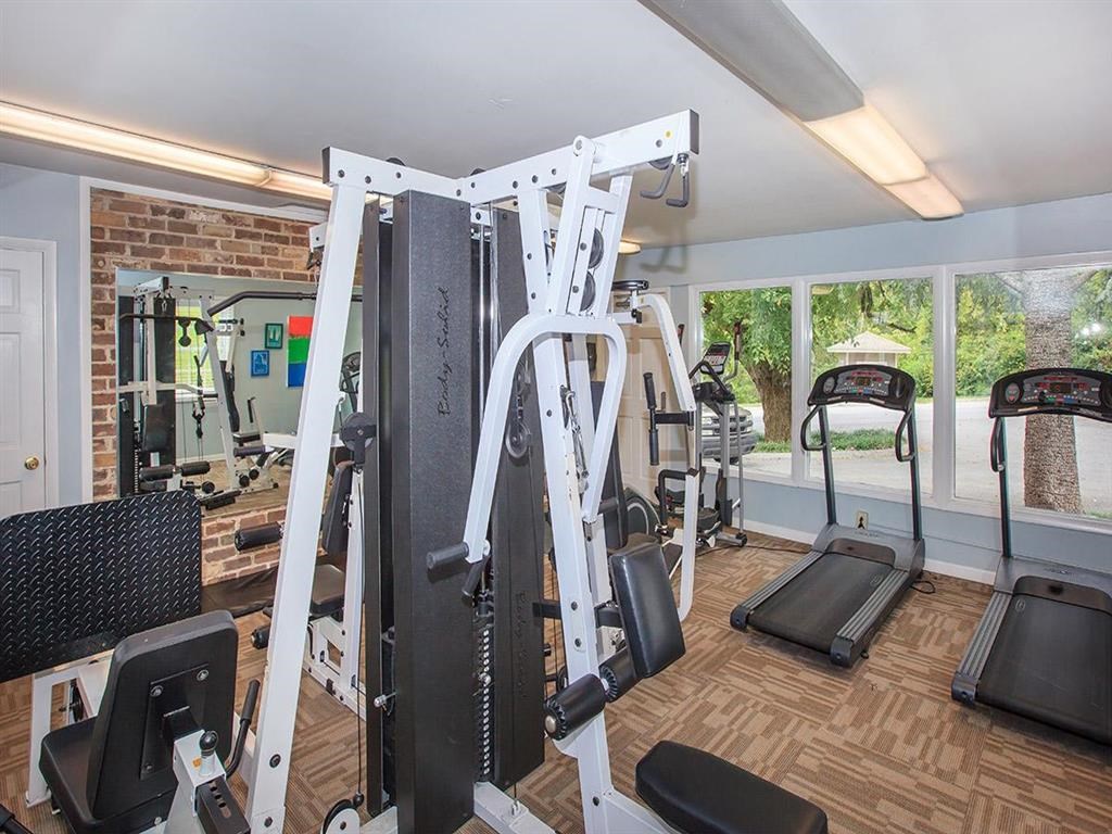 the gym has a lot of equipment in it