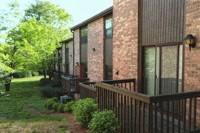 a row of brick houses with a wooden deck