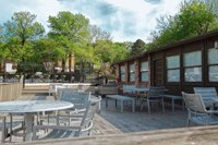 a view of the patio of a restaurant with tables and chairs