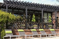 a row of lounge chairs in front of a restaurant
