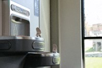 a parking meter next to a window