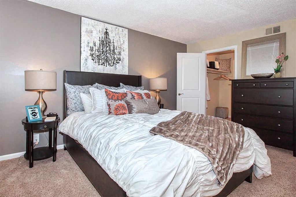 a bedroom with a bed and a closet