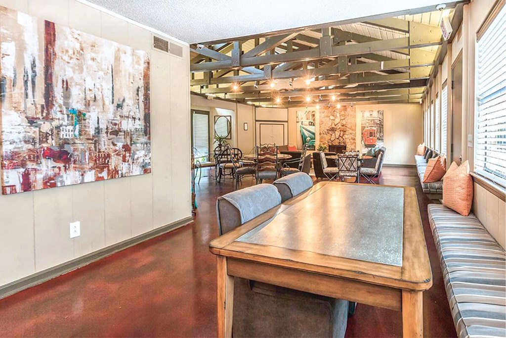 a large room with a table and chairs in it