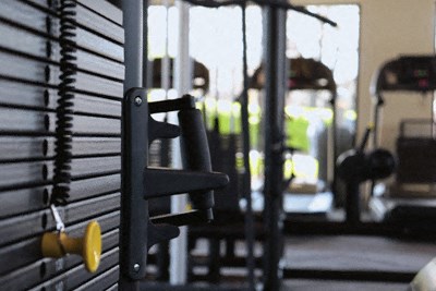a gym with weights and other equipment in it