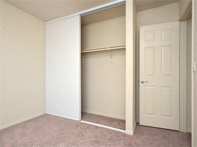 Bedroom  closet l Casa Bella Apartments in Victorville CA
