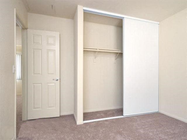 Bedroom  closet l Casa Bella Apartments in Victorville CA