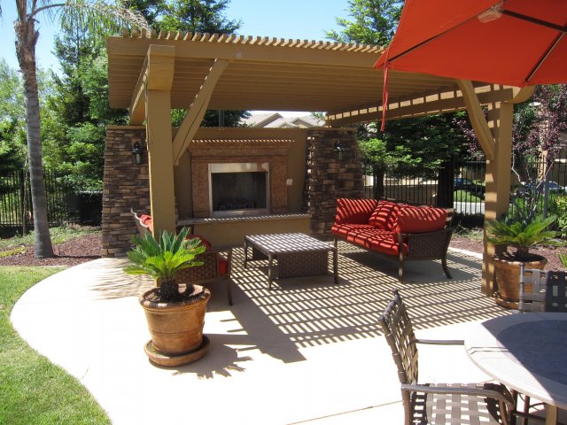 Pet-Friendly Apartments in Roseville, CA- Pinnacle at Galleria- Canopy with Fireplace and Outdoor Furniture