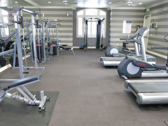 Roseville CA Apartments for Rent - Pinnacle at Galleria - Resident Fitness Center With a Treadmill, Elliptical, Ceiling Fans, and Additional Exercise Machines