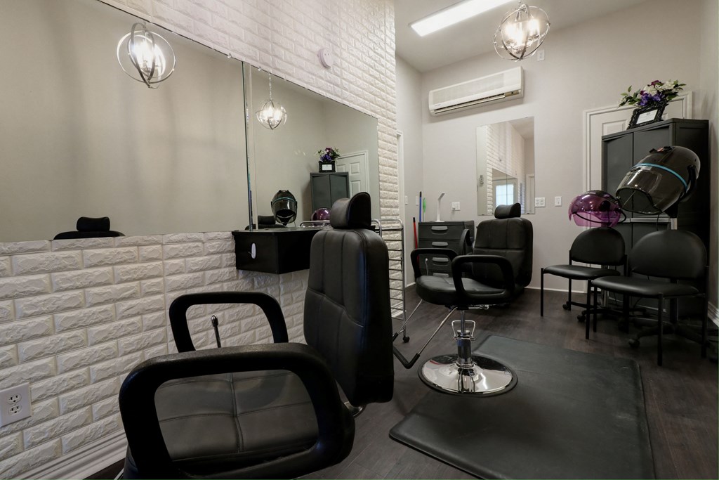 Modern salon with professional styling chairs and mirrors, offering luxury salon services.