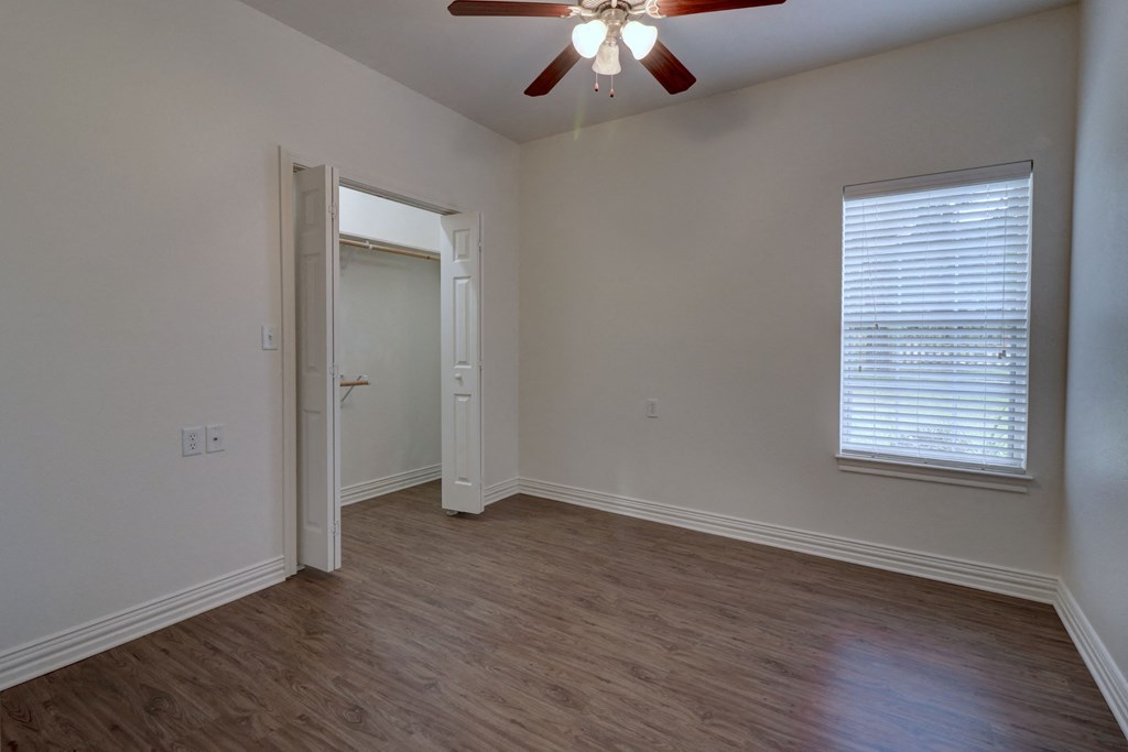 Comfortable bedroom at Legend of Lindale, a 55+ active senior living community.