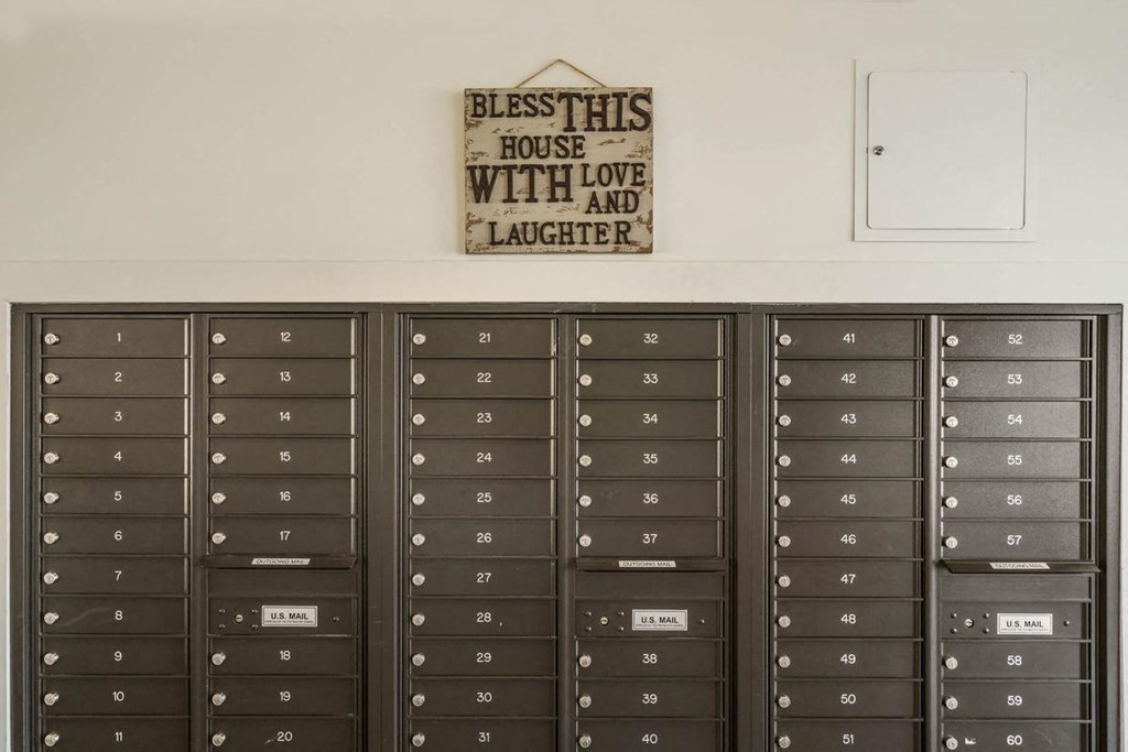 a bunch of lockers in a room with a sign above them