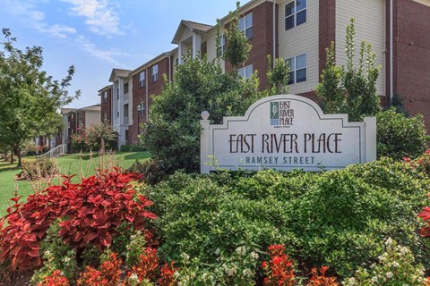 a sign for east river place in front of an apartment building