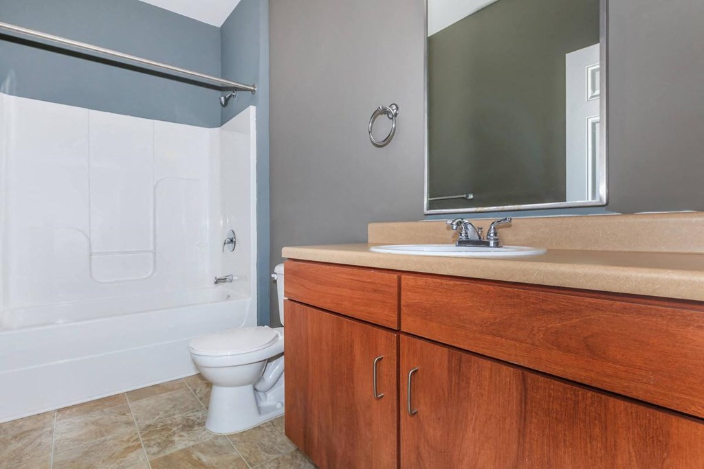 a bathroom with a sink toilet and a shower
