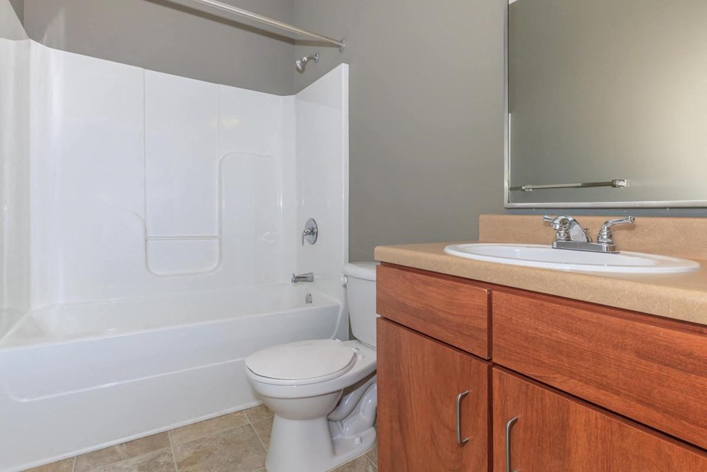 a bathroom with a sink toilet and a bath tub