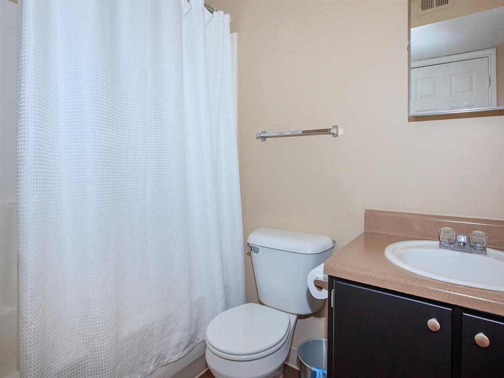a bathroom with a toilet and a sink