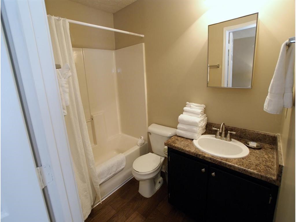 a bathroom with a sink toilet and a shower
