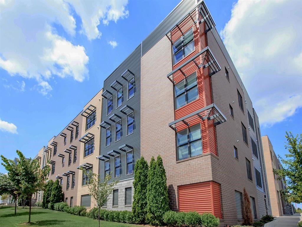 a large apartment building with many windows on the side of it