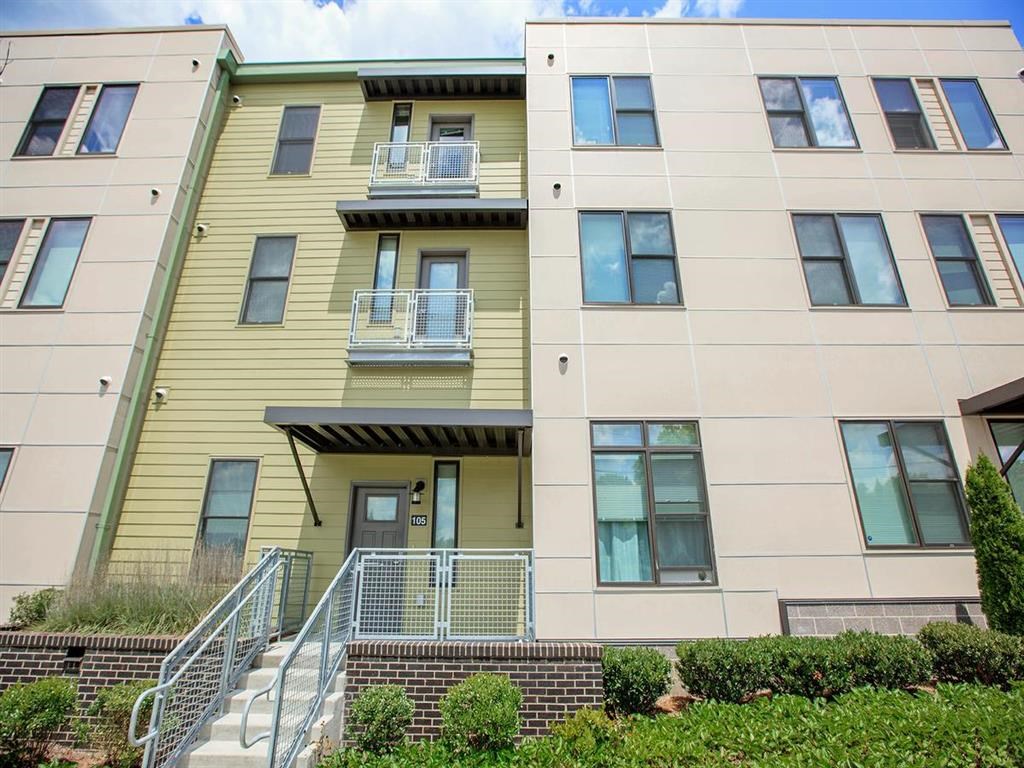 a large apartment building with stairs and balconies
