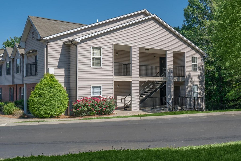 a white house with a street in front of it