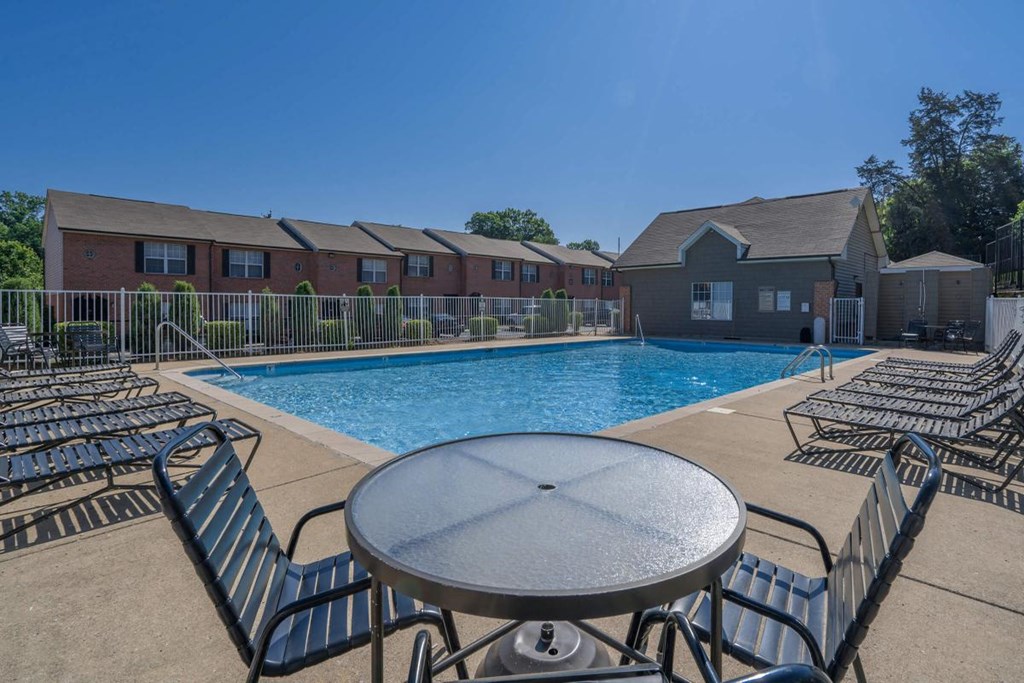 our apartments offer a swimming pool with chairs and tables