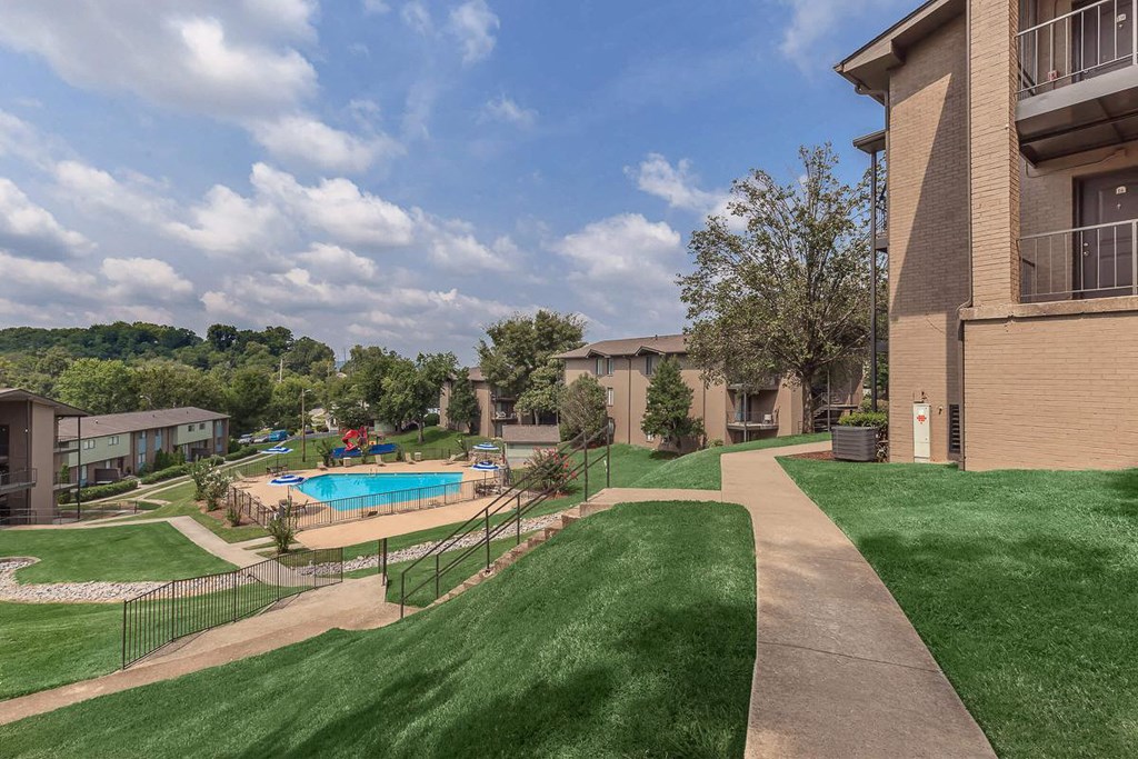 a view of a yard with a pool and buildings