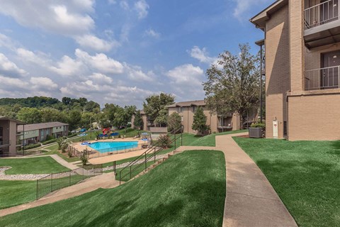 a view of a yard with a pool and buildings