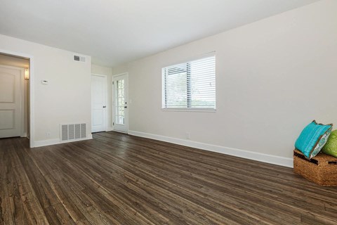 a living room with a couch and a window