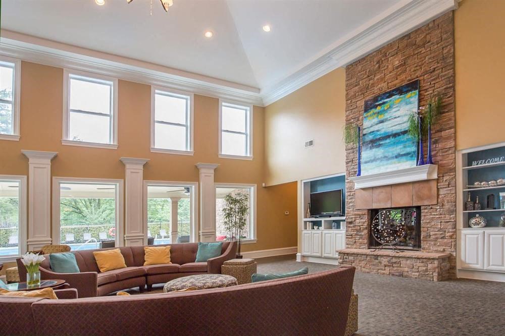 a living room with a couch and a fireplace