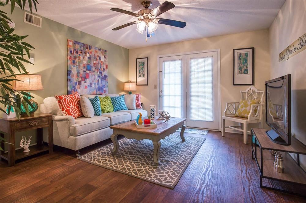 a living room with a couch and a tv