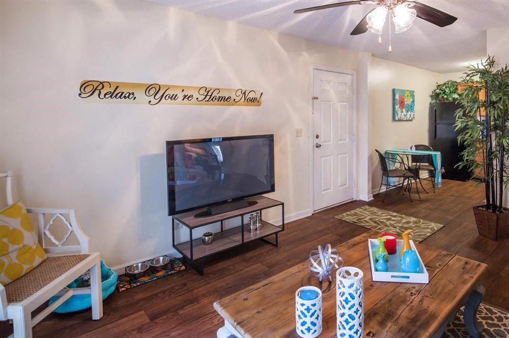 a living room with a tv and a table