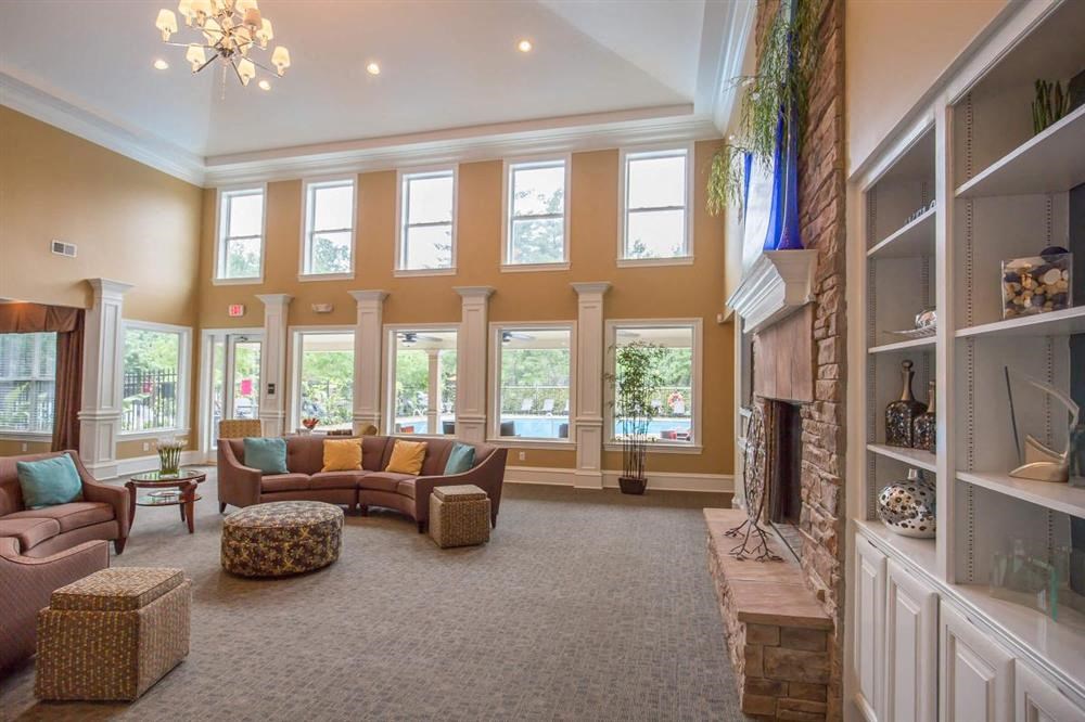 a living room with couches and a fireplace