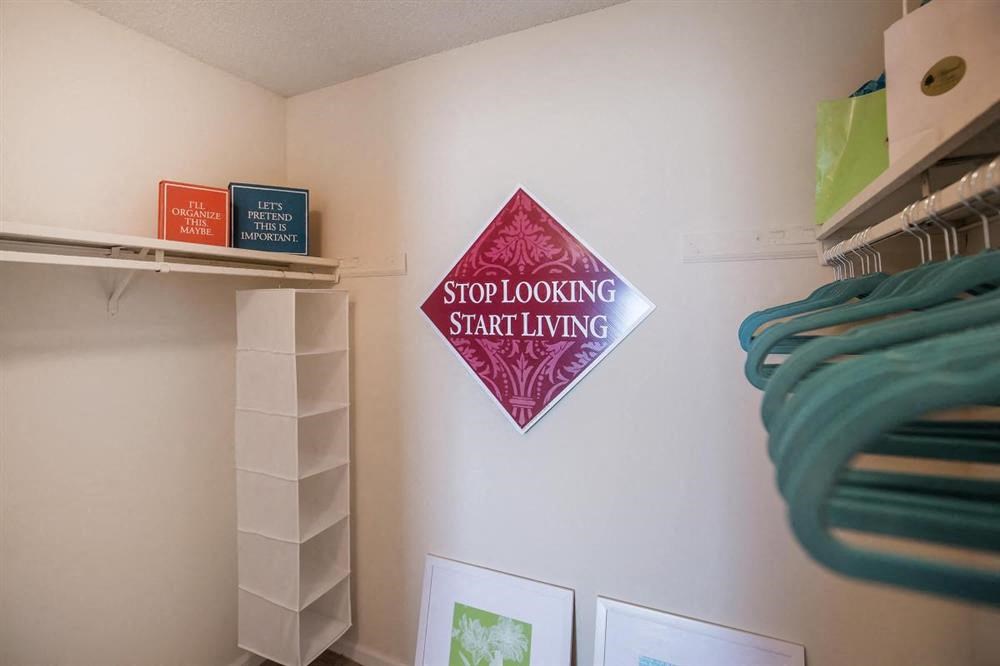 a stop looking starting sign on the wall of a closet