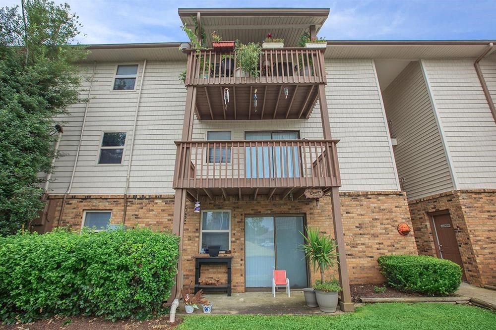 the front of an apartment building with a balcony