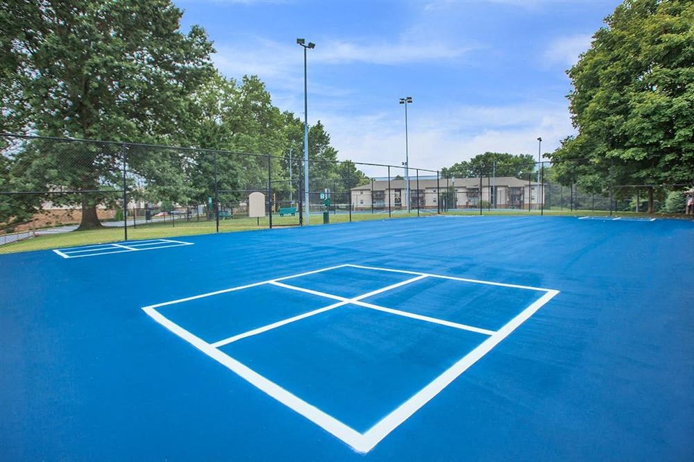 a blue tennis court with white lines on it