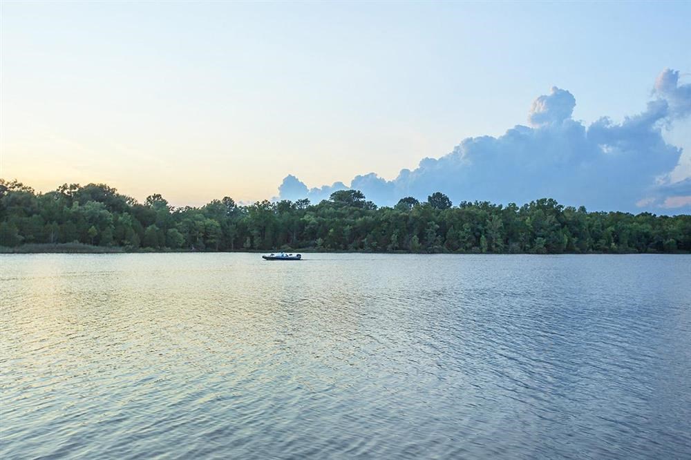 a small boat on a large body of water