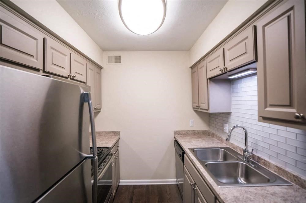 a kitchen with stainless steel appliances and a sink