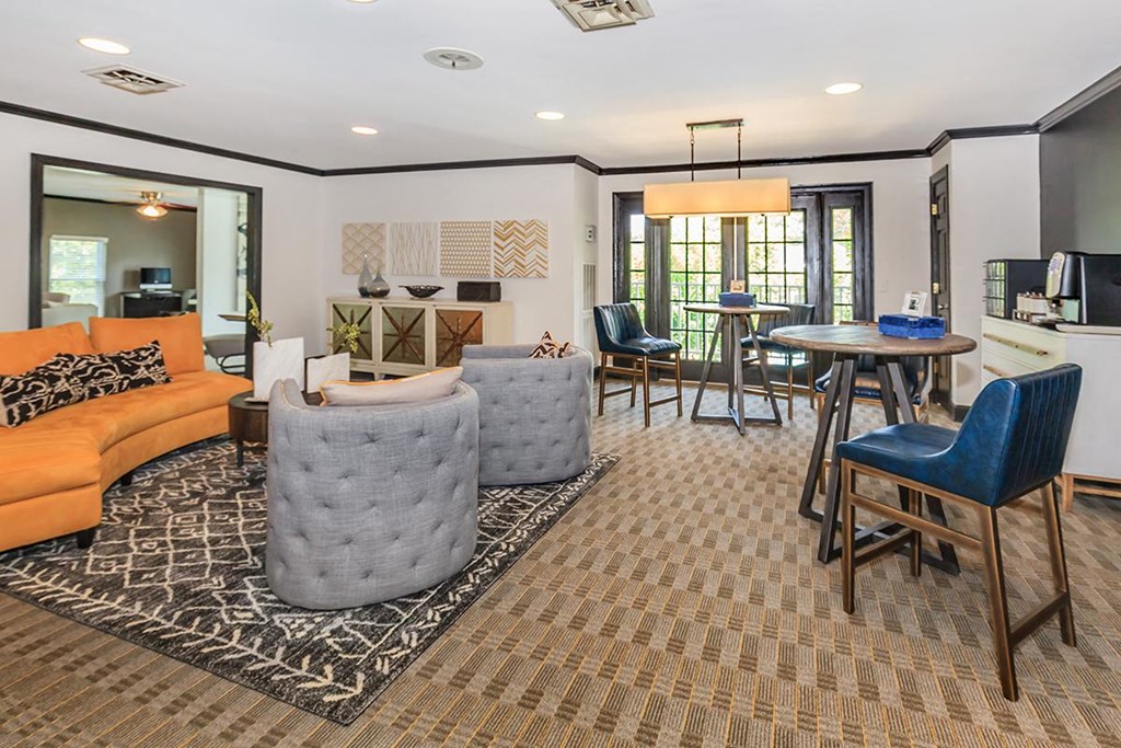 a living room and dining room with a couch and a table