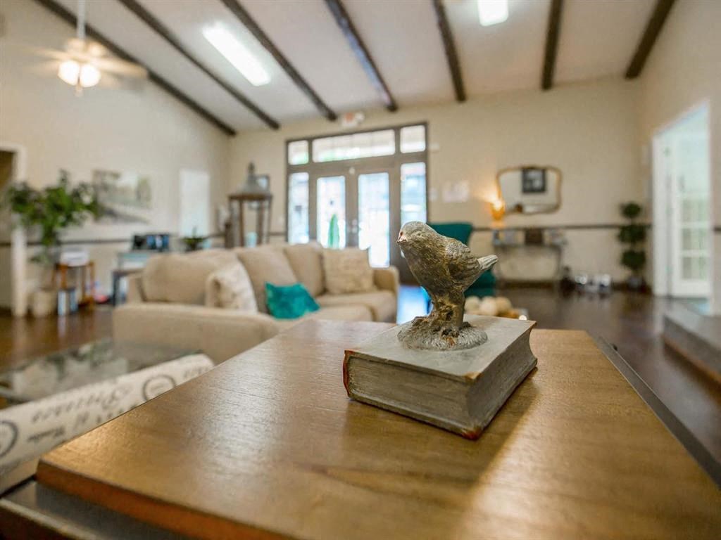 a living room with a table with a book