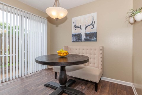 a dining room with a table and a window