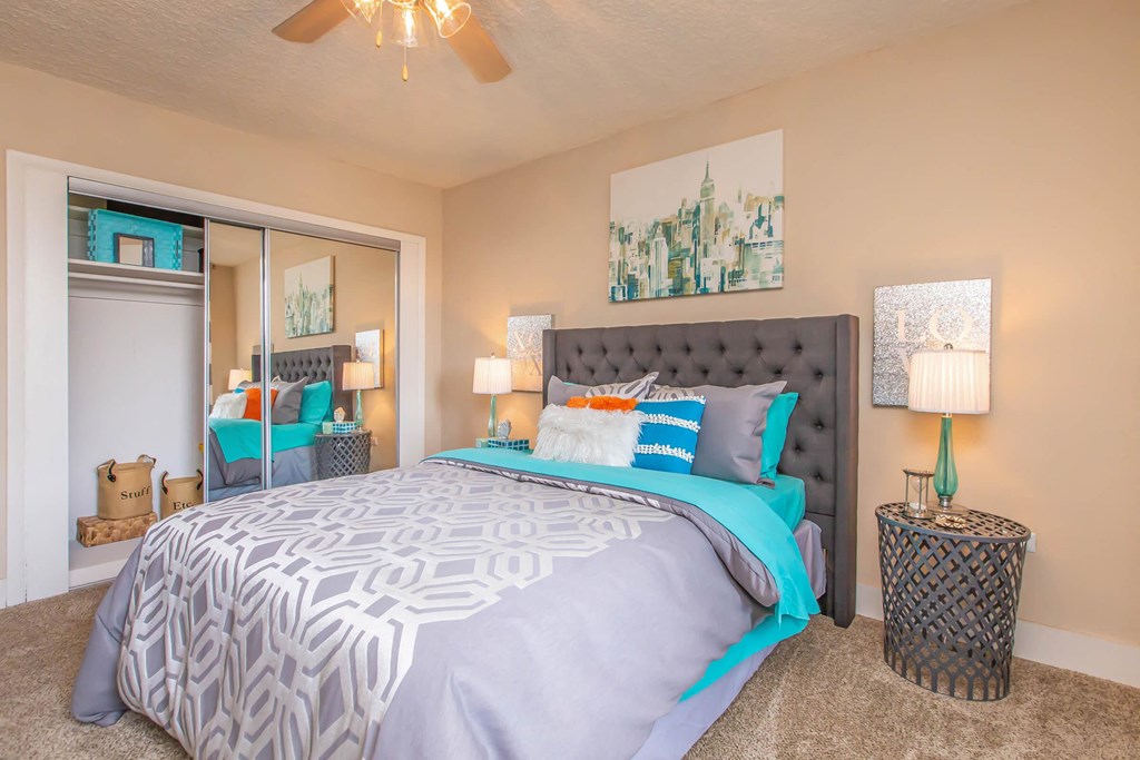 a bedroom with a large bed and a closet