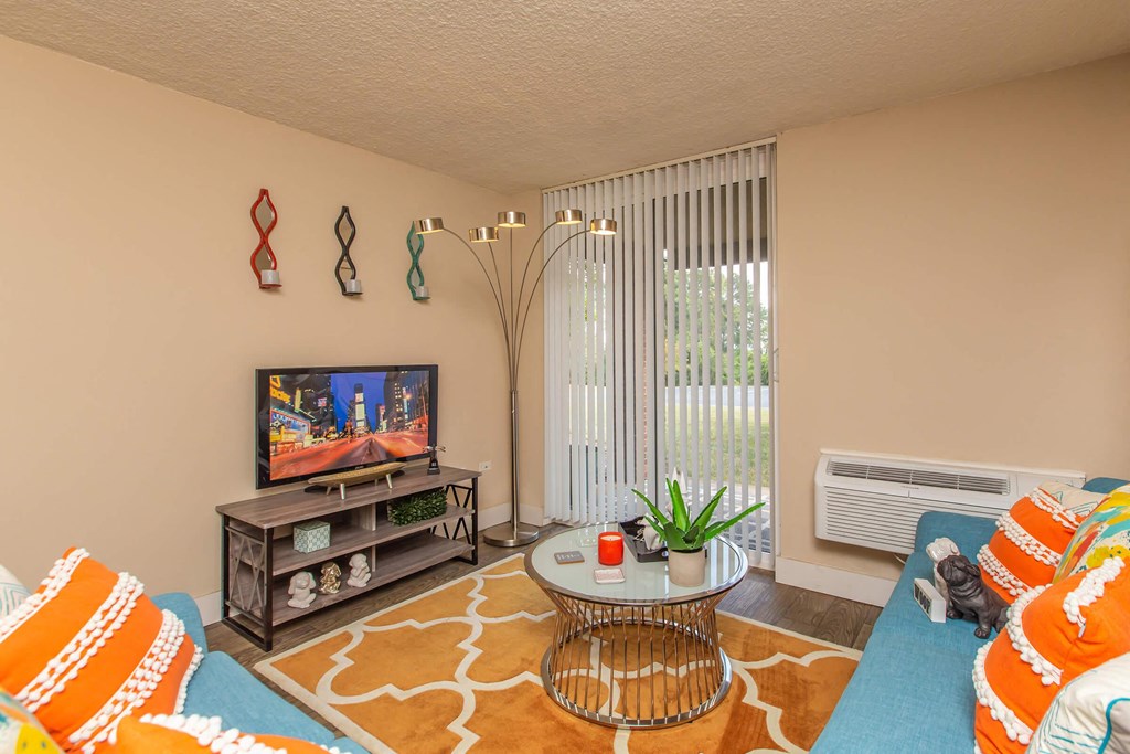 a living room with a couch and a tv
