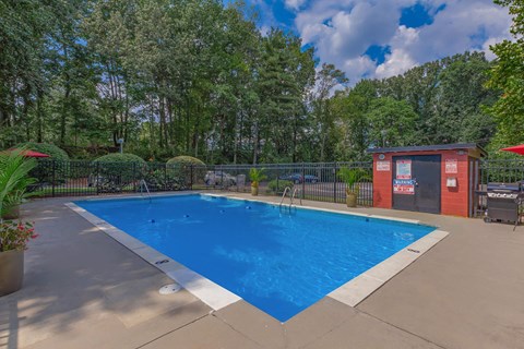 the swimming pool at our apartments with a blue pool