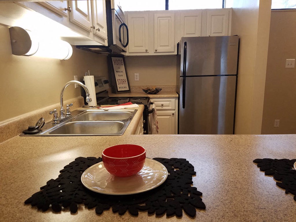 a kitchen with a counter top and a sink