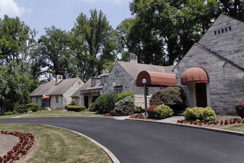 a house with a driveway and a road in front of it
