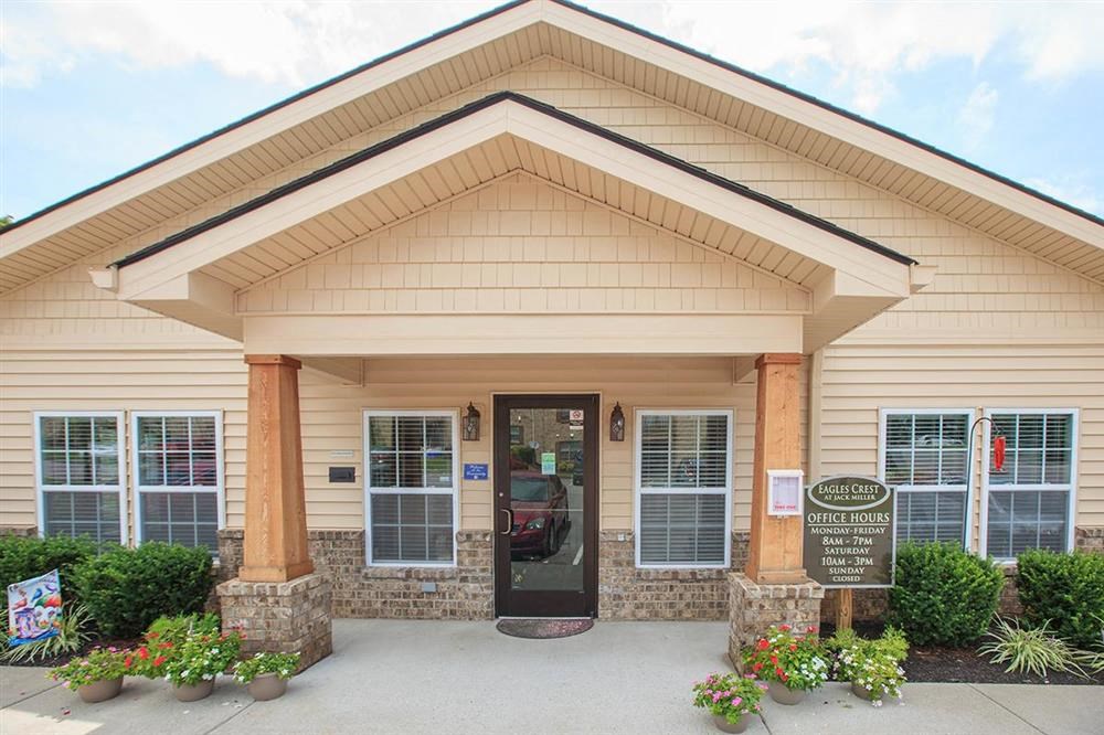 a building with a door and a sign in front of it