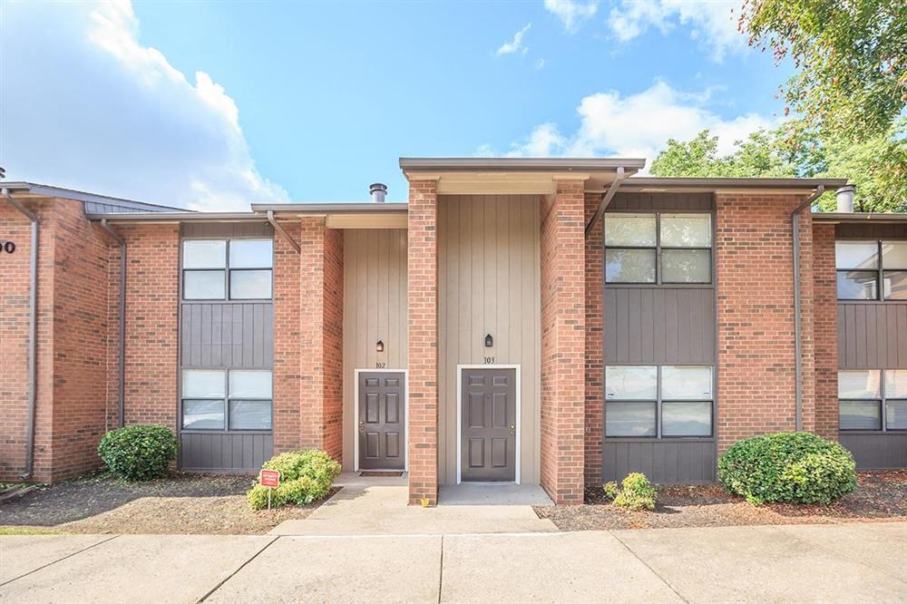 the front of a brick building with two doors