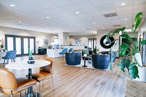 A modern dining area with a white table and chairs.